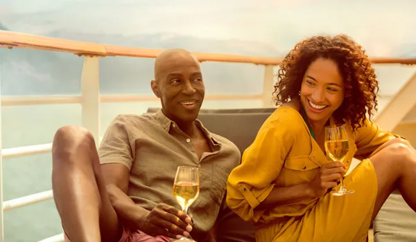 Couple enjoying drinks on deck