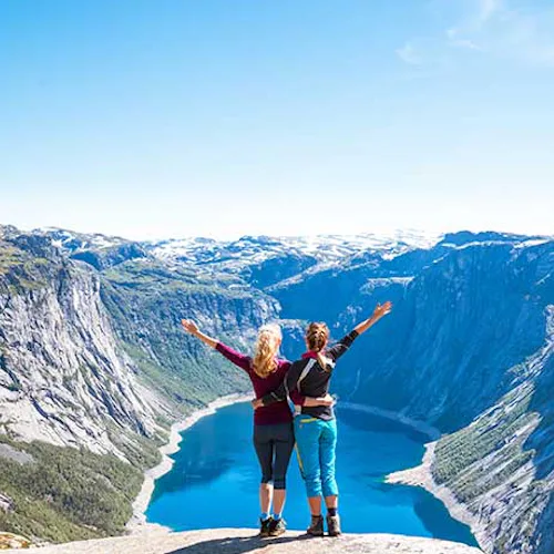 Friends overlooking Trolltunga Norwegian Fjords