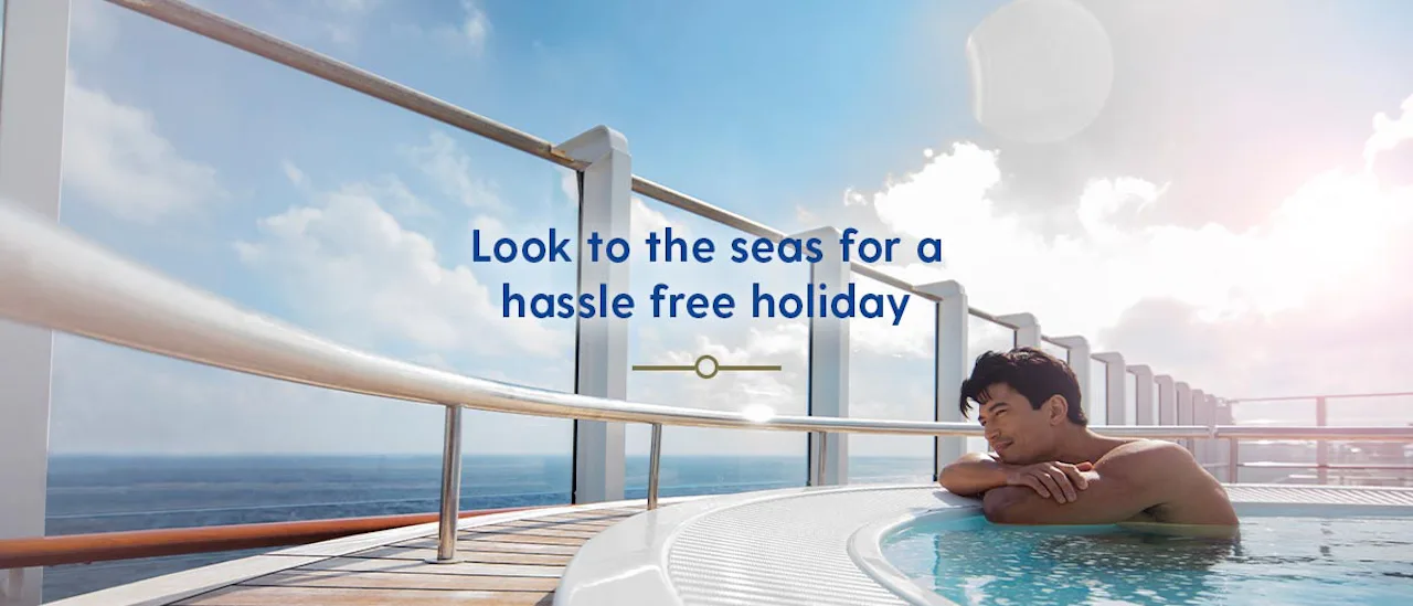 Man gazing out to see in a hot tub on deck